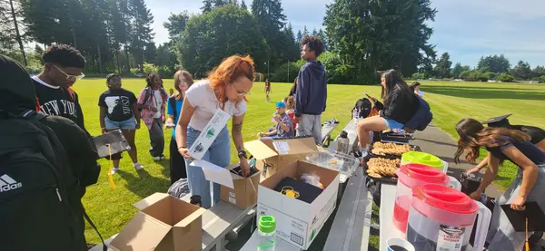 Program leaders connecting with community families