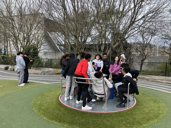 Smiling youth and community celebrating program achievements